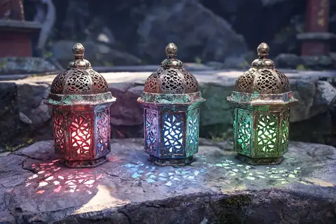 Three carved lanterns glowing with moonlight at a shrine
