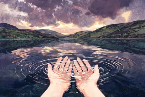 Hands cupping water from a loch under a stormy sky